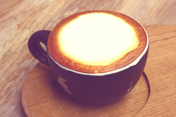 a cup of hot coffee in vintage tone, like instagram filter effect
