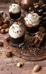 hot chocolate in glass cups and cream with nuts