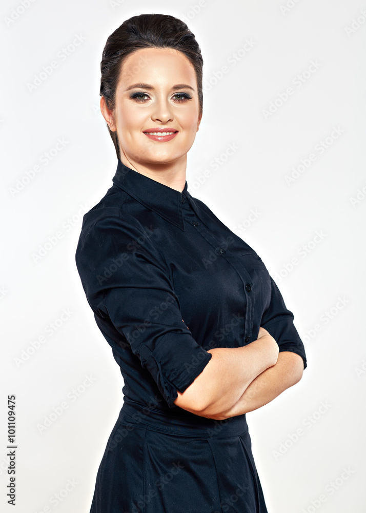 Wall mural smiling business woman standing against isolated gray backgroun