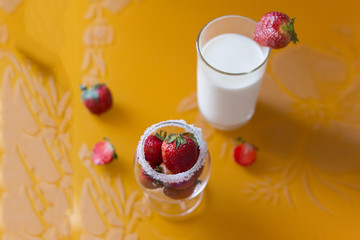 Strawberry in a glass of milk breakfast fruit with sugar