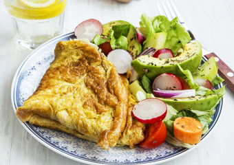 Omelette with salad and lemon water breakfast meal