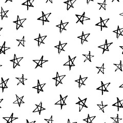 Hand drawn with ink seamless pattern with black stars. Abstract grunge seamless pattern. Stars on white background.