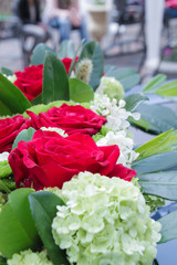 Flowers in a row
Row of red and white flowers, wedding day.