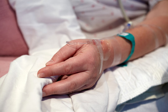 Hospital Patient's Hand with IV Drip