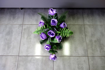 Grave wreath made of artificial roses