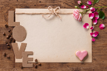 Vintage greeting card for Valentine's day on wooden table. View from above. Valentines Day concept