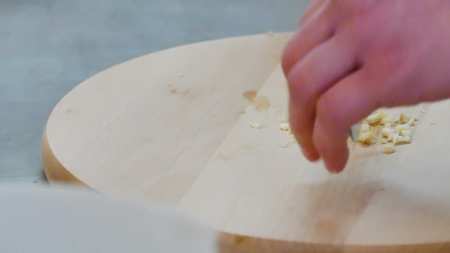 Shredding garlic in slow motion, Food Preparation by Chef, Slow Motion Video Clip