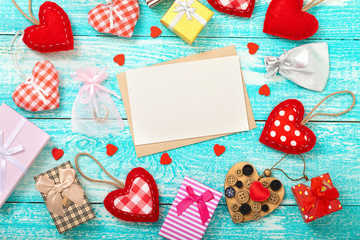 Valentine's day background with heart shapes on wooden table.