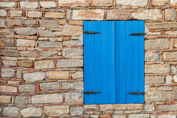 Fototapeta na wymiar Wall with blue window