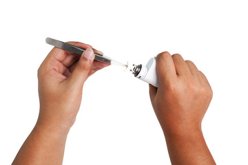 Human hand performing maintenance an electronic cigarette,vaper over white background, how to recoil vape rda