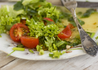 food salad with tomato  fork and knife