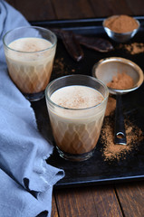 Carob Drink, Cocoa or Coffee Milk Drink on dark background