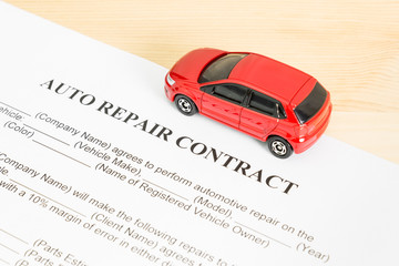Auto Repair Contract With Red Car on Right View