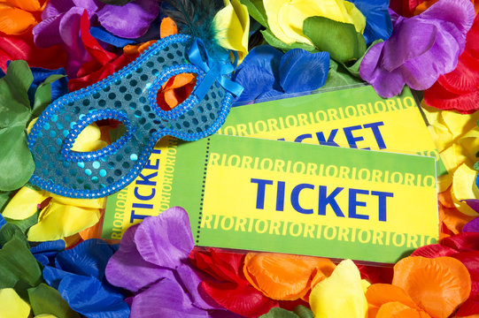 Brazil tickets sit with sparkly carnival mask on colorful flower lei background