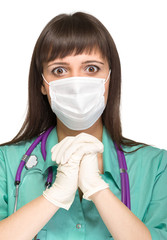 praying female medical doctor with mask isolated