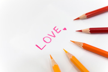 wording  "Love" with little heart on white background , encircle with color pencils
