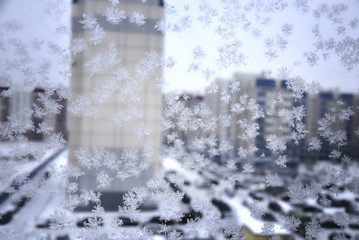 Obraz na płótnie Canvas snowflake on the window