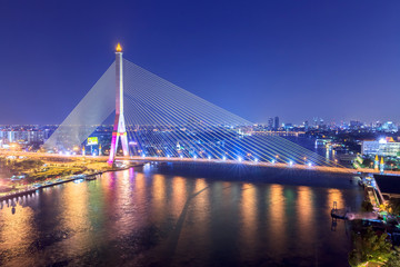 Rama VIII Bridge at night in Bangkok and Chopraya river, Thailan