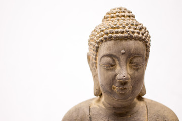 Buddha statue close up on a white background 