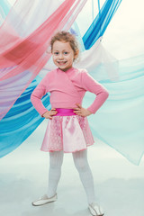 A little girl in a beautiful skirt