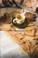 a representation of breakfast time on bed, with coffee espresso, rusks with marmelade, typical mediterranean breakfast