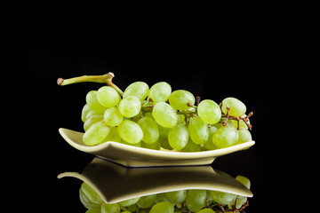 White grapes on a black background