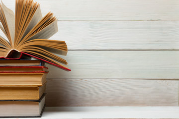 Law book with wooden judges gavel on table in a courtroom or law enforcement office.