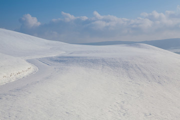 Winter road under blue sky