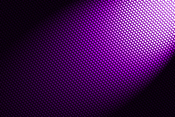 spotlight on purple carbon fiber background.
