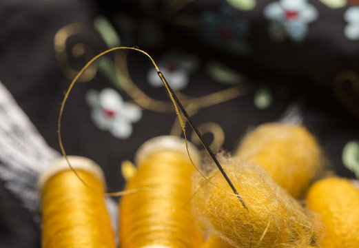 raw silk, bobbins and silk embroidered cloth