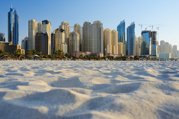 Fototapeta na wymiar Skyscrapers of Dubai Marina from Marina beach