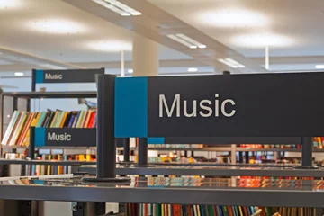 Aluminium Prints Music store  Music section sign inside a modern public library
