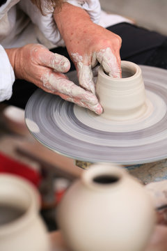 Hands of a potter creating
