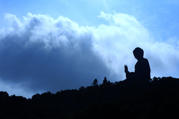 A silhouette sunset at Hong-kong / Buddha on the mountain