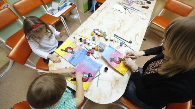 Creative children draw and mold from clay