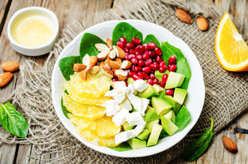 Spinach feta avocado pomegranate orange almond salad with orange