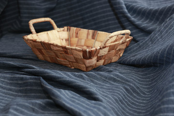 Bread basket on blue fabric