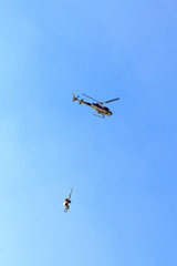 Transport helicopter flying with supplies