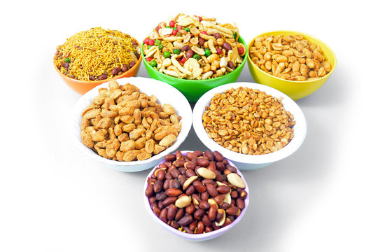 Mix nimko, peanut and chole in bowl isolated on white background