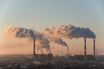 View of city's manufacturing sector at sunset
