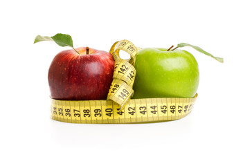 Apples, flowers and measuring tape. 
