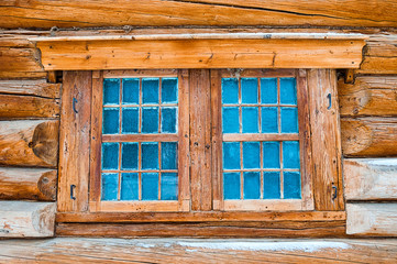 Obraz na płótnie Canvas Wooden hut with window