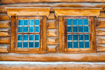 Windows in wooden log hut