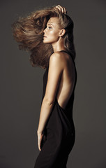Fototapeta premium Portrait of adorable blonde with long beautiful hair