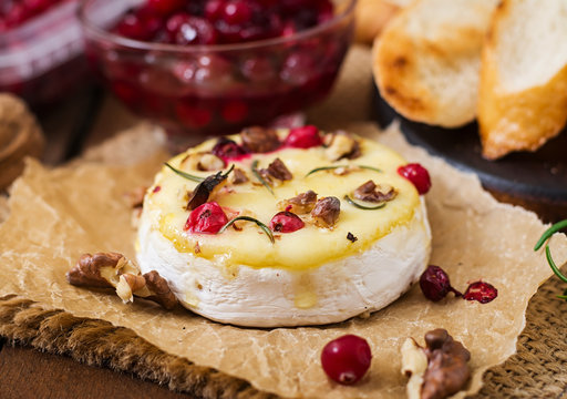 Baked cheese Camembert with cranberries and nuts