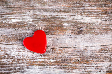 Red heart on grunge wood background