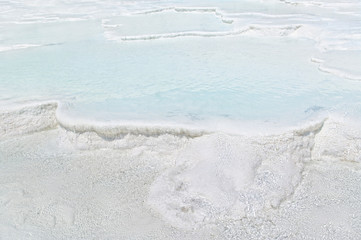 clear turquoise blue waters flowing on travertine terraces