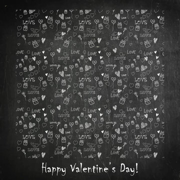 Valentines Day card with heart made from love symbols hand-drawn on blackboard