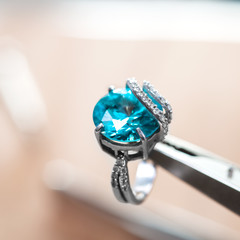 Desktop jeweler. silver ring on the desktop jeweler