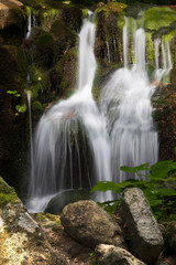 Obraz premium Small waterfall on a creek Ponikly in mountains Jeseniky